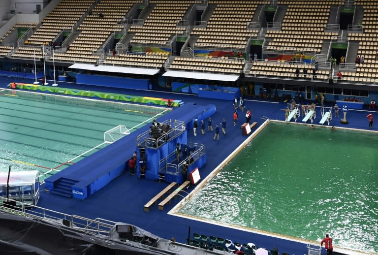 The murky green water polo pool (L) and the dark green diving pool