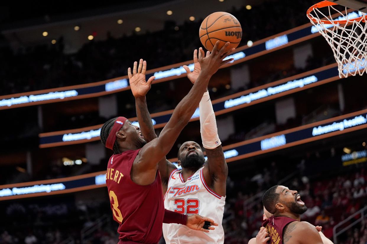 Cleveland Cavaliers' Caris LeVert (3) goes up for a shot as Houston Rockets' Jeff Green (32) defends Saturday in Houston.