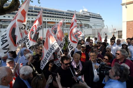 FILE PHOTO: Members of "No grandi navi - No big ships" movement protest in front of the MSC Opera cruise ship that early in the morning crashed against a smaller tourist boat at the San Basilio dock in Venice