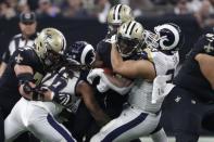 Jan 20, 2019; New Orleans, LA, USA; New Orleans Saints running back Alvin Kamara (41) is tackled by Los Angeles Rams nose tackle Ndamukong Suh (93) during the fourth quarter of the NFC Championship game at Mercedes-Benz Superdome. Mandatory Credit: Derick E. Hingle-USA TODAY Sports