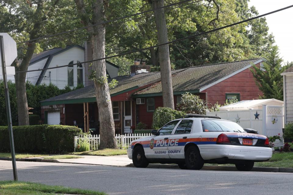 PHOTO: A Nassau County police car is parked outside the home of alleged killer Rex Heuermann, July 26, 2023,in Massapequa Park, N.Y. (James Carbone/Newsday RM via Getty Images)