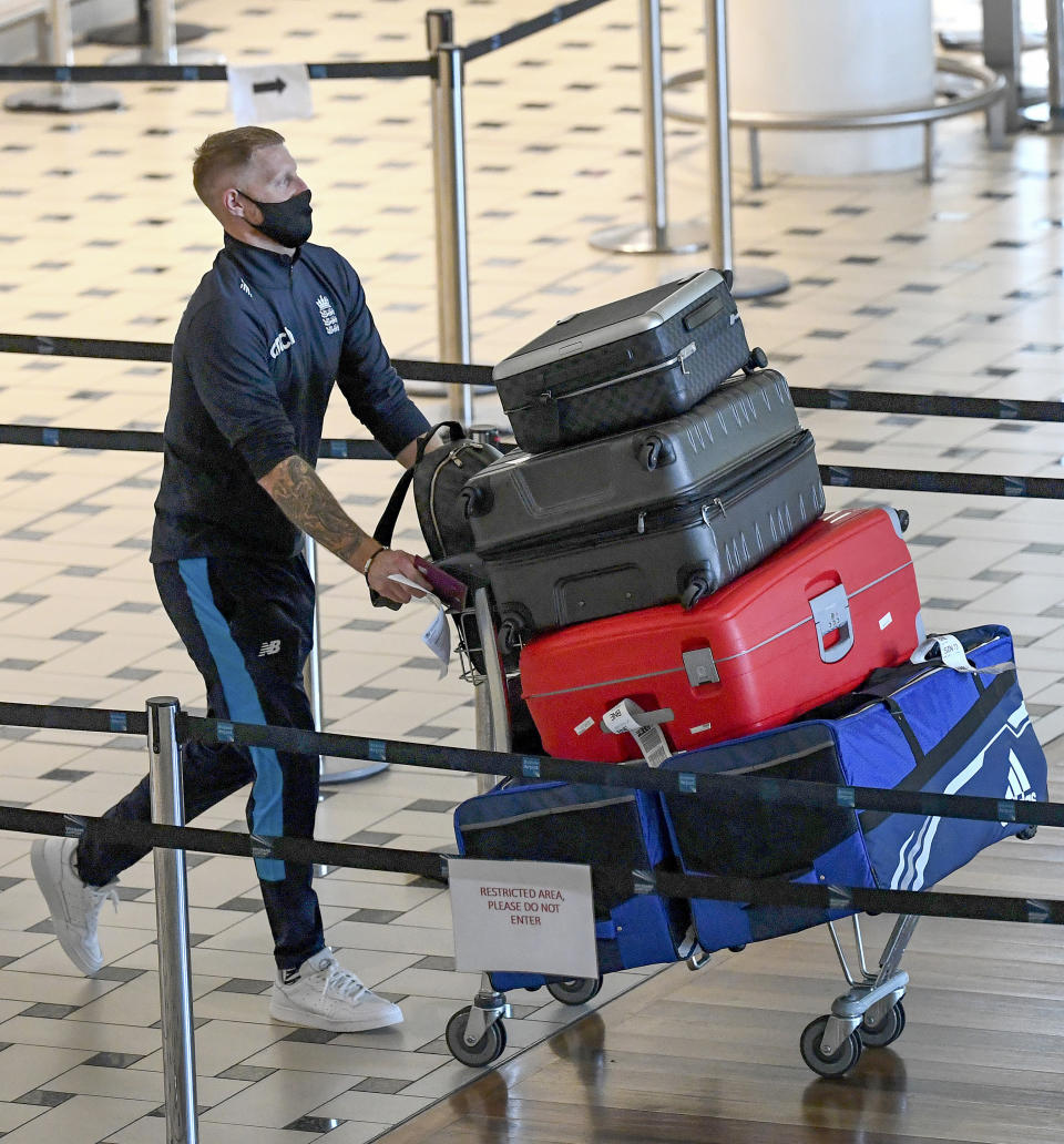England cricketer Ben Stokes walks through the terminal at Brisbane Airport in Australia, Saturday, Nov. 6, 2021. The England cricket team have arrived in Australia ahead of a five test Ashes series beginning on Dec. 8 in Brisbane. (Dave Hunt/AAP Image via AP)