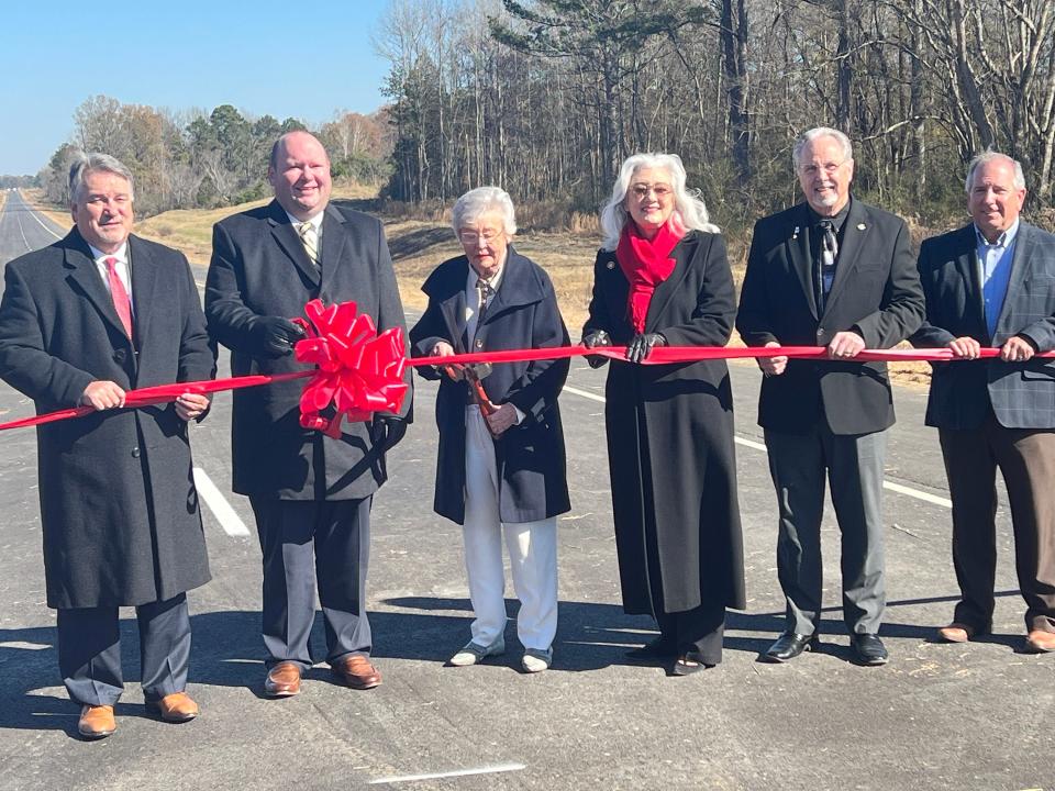 From left, House Speaker Nathaniel Ledbetter, R-Rainsville; Sen. Andrew Jones, R-Centre; Gov. Kay Ivey; Rep. Ginny Shaver, R-Leesburg; Rep. Mark Gidley, R-Gadsden; and Curtis Vincent, ALDOT North Region engineer, cut the ceremonial ribbon on Nov. 29, 2023, opening the new stretch of U.S. Highway 411 that makes it four lanes from Cherokee County to Etowah County.