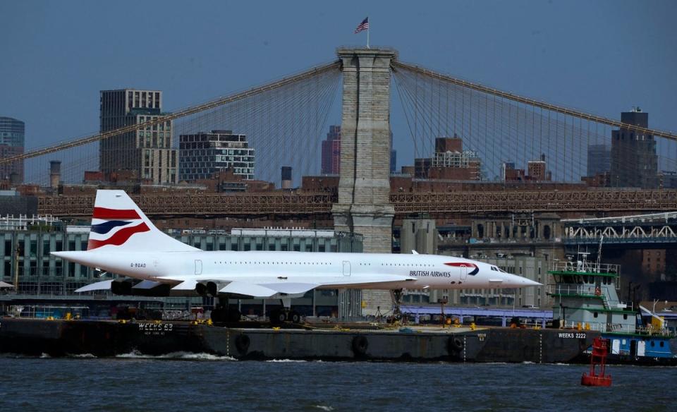 The supersonic jet goes under the Brooklyn Bridge in New York (AFP via Getty Images)