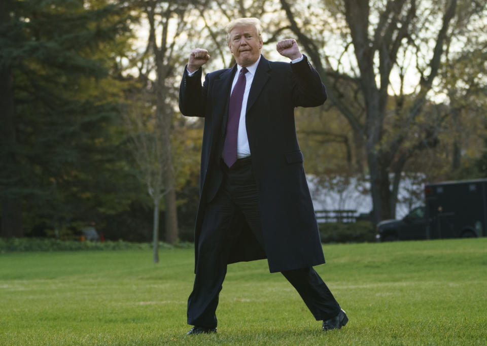 President Donald Trump gestures as he walks to Marine One after speaking to media at the White House in Washington, Tuesday, Nov. 20, 2018, for the short trip to Andrews Air Force Base en route to Palm Beach International Airport, in West Palm Beach, Fla., and on to and onto Mar-a-Lago. (AP Photo/Carolyn Kaster)