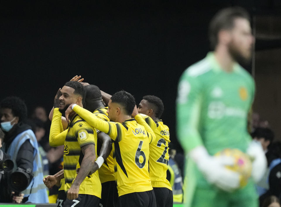 Watford's Ismaila Sarr celebrates with teammates after scoring his side's second goal during the English Premier League soccer match between Watford and Manchester United at Vicarage Road, Watford, England, Saturday, Nov. 20, 2021. (AP Photo/Frank Augstein)