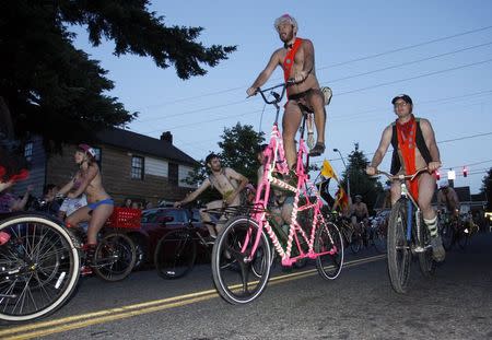 Cyclists pour into the streets of Portland for the 11th annual World Naked Bike Ride June 7, 2014. REUTERS/Steve Dipaola