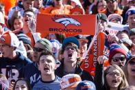 Feb 9, 2016; Denver, CO, USA; Denver Broncos fans cheer and hold signs prior to the Super Bowl 50 championship parade at Civic Center Park. Mandatory Credit: Isaiah J. Downing-USA TODAY Sports