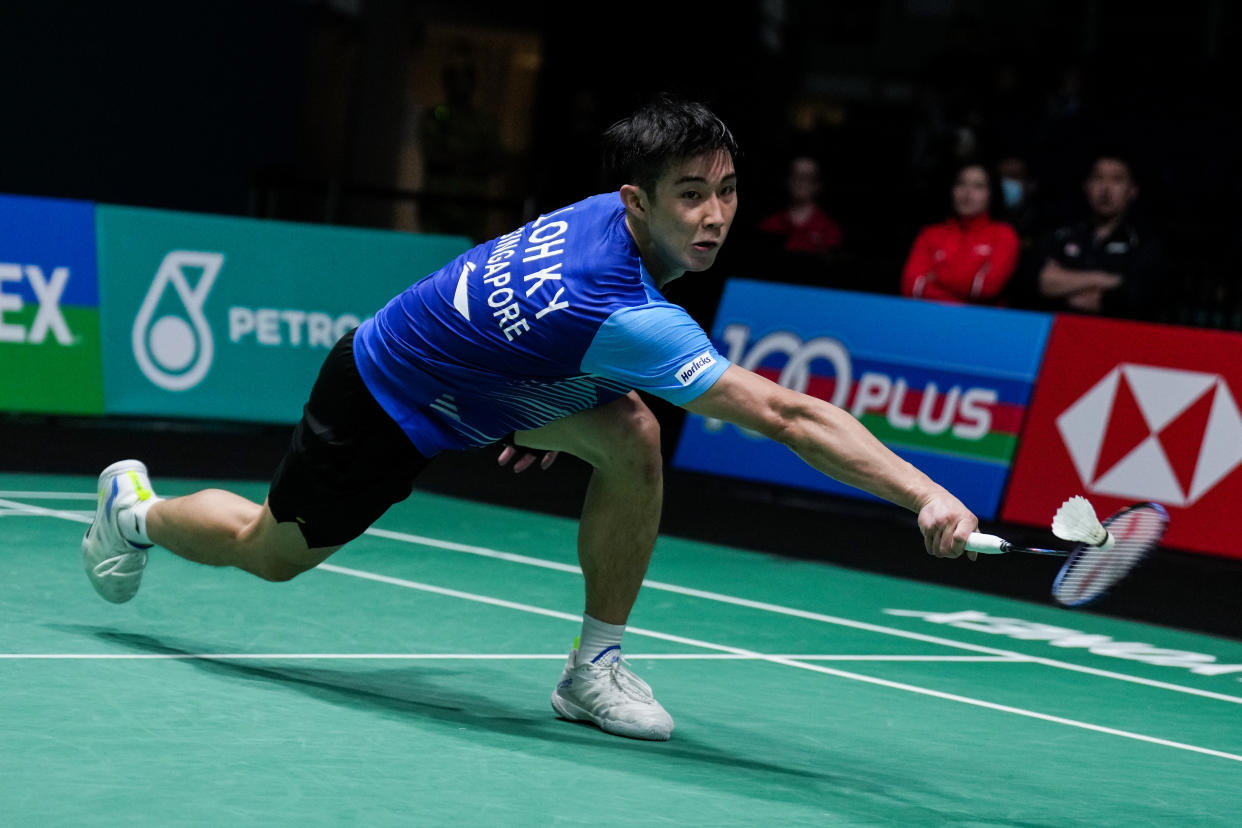 Singapore shuttler Loh Kean Yew retrieves a shot against Thailand's Kunlavut Vitidsarn at the Malaysian Open quarter-finals.