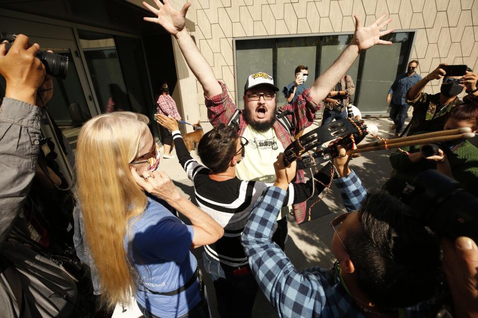 Vito Gesualdi, center, yells in support during a walkout by Netflix employees.