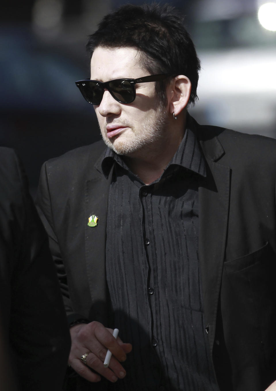 FILE - Irish singer Shane MacGowan attends the funeral mass of Irish poet Seamus Heaney at the Church of the Sacred Heart in Donnybrook, Dublin, Ireland, Monday, Sept. 2, 2013. Macgowan, the singer-songwriter and frontman of The Pogues, best known for their ballad “Fairytale of New York,” has died. He was 65. His family said in a statement that "it is with the deepest sorrow and heaviest of hearts that we announce the passing of our most beautiful, darling and dearly beloved Shane Macgowan.” The singer died peacefully early Thursday, Nov. 30, 2023 with his family by his side, the statement added. (AP Photo/Peter Morrison, File)