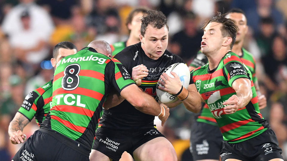 Dylan Edwards is seen here running the ball for the Panthers in the grand final win over the Rabbitohs.