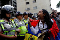 <p>A demonstrator shouts slogans in front of police officers during a women’s march to protest against President Nicolas Maduro’s government in Caracas, Venezuela May 6, 2017. (Photo: Carlos Garcia Rawlins/Reuters) </p>