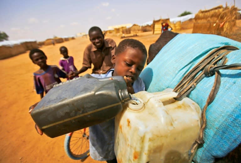 South Sudanese refugees fill water jugs at Al-Nimir refugee camp in Sudan's east Dafur in June 2017. Some 461,000 refugees have arrived in Sudan since December 2013 when a brutal civil war erupted in South Sudan