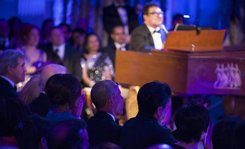 U.S. President Barack Obama, first lady Michelle Obama, Japanese PM Shinzo Abe and his wife Akie Abe watch the Jersey Boys perform in the State Dining Room during a State Dinner at the White House