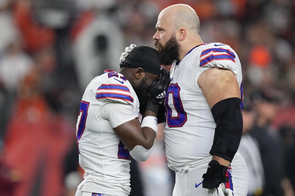 CINCINNATI, OHIO - JANUARY 02: Tre'Davious White #27 and Mitch Morse #60 of the Buffalo Bills react to teammate Damar Hamlin #3 collapsing after making a tackle against the Cincinnati Bengals during the first quarter at Paycor Stadium on January 02, 2023 in Cincinnati, Ohio. (Photo by Dylan Buell/Getty Images)