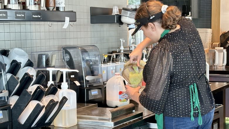 Starbucks barista making drink