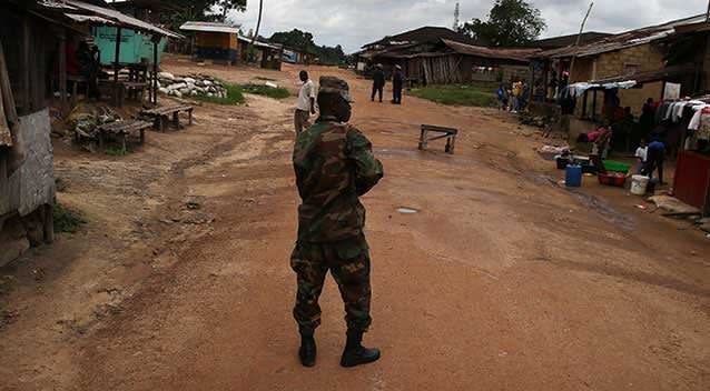 A Liberian army soldier enforces a quarantine. Picture: Getty