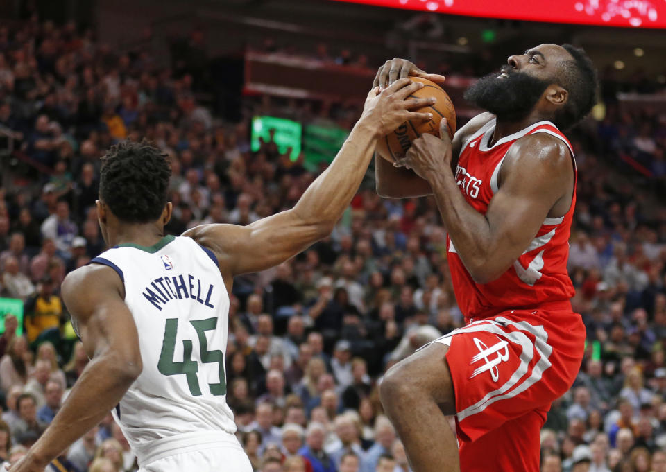 Jazz rookie Donovan Mitchell has been tasked with defending Rockets star James Harden. (AP)