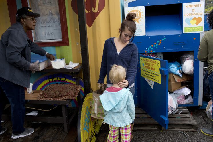 Free food and clothes are distributed to anyone who needs them in downtown Braddock, Pa., on Oct. 13, 2016. (Photo: Andrew Lichtenstein/Corbis via Getty Images)