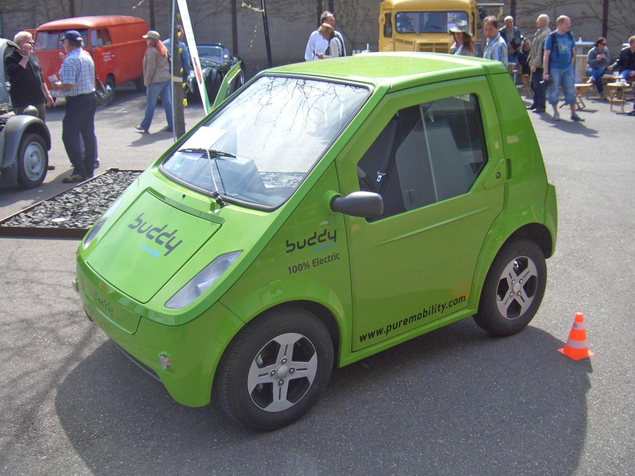 Lime green Buddy Electric Vehicle, 2010 Model, parked on street