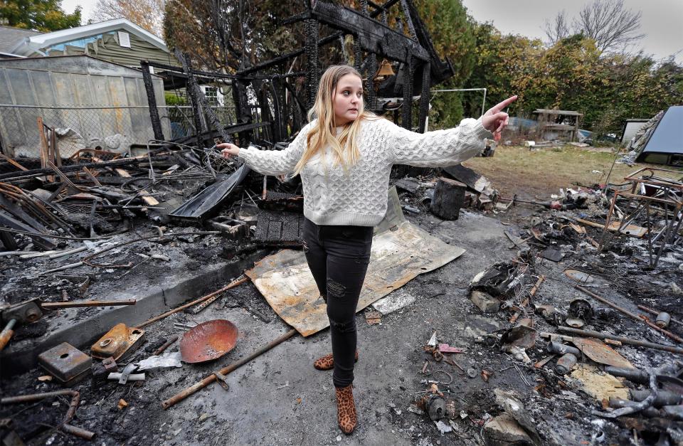 Makayla Green, 16, of Manitowoc, points out burned areas at the home she was hoping to live in with her grandmother in the 3300 block of Mero Street, on Wednesday, Oct. 27, 2021, in Manitowoc. Arson is suspected as the cause and there is a reward for the identification of the possible arsonist.