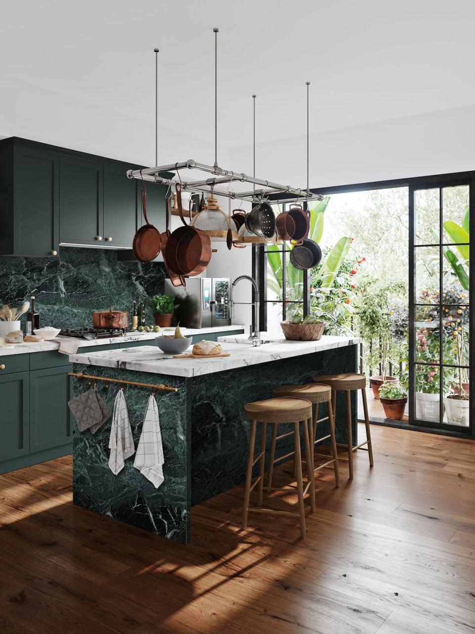 <p>We're crushing on this dark green kitchen island, which has a rather impressive display of pots hanging above, which also saves on additional storage space. </p><p>'When it comes to designing a kitchen island, more and more homeowners are opting for a statement look, either through the use of painted cabinetry or a wow-factor worktop with vibrant colours,' says Laura Davie, Marketing Manager for <a href="https://www.cosentino.com/en-gb/" rel="nofollow noopener" target="_blank" data-ylk="slk:Cosentino UK;elm:context_link;itc:0;sec:content-canvas" class="link ">Cosentino UK</a>. <br></p><p>• See more from <a href="https://geraldculliford.co.uk/product/verde-tinos/" rel="nofollow noopener" target="_blank" data-ylk="slk:Cullifords;elm:context_link;itc:0;sec:content-canvas" class="link ">Cullifords</a></p>