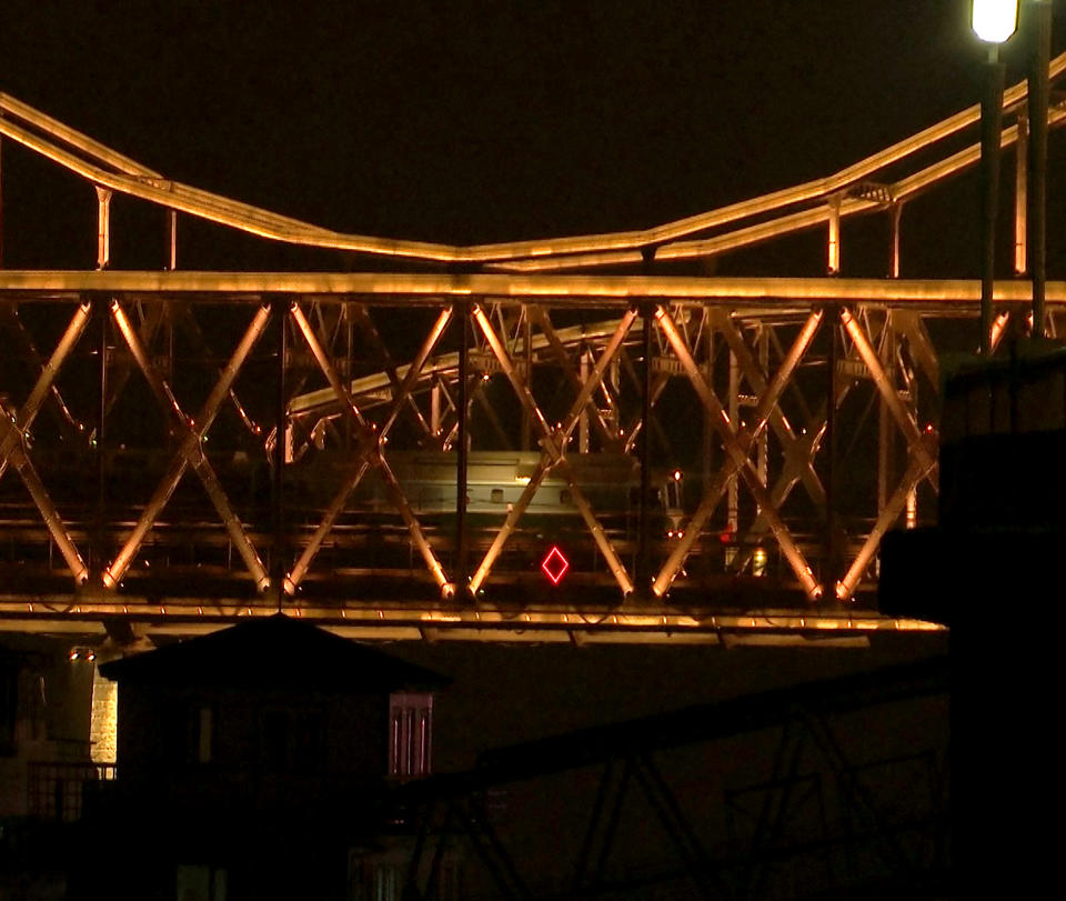 In this Feb. 23, 2019, file image taken from video footage, a train similar to ones seen during previous visits to China by North Korean leader Kim Jong Un crosses the Friendship Bridge from North Korea into China as seen from Dandong in northeastern China's Liaoning Province. (AP Photo/Dake Kang, File)