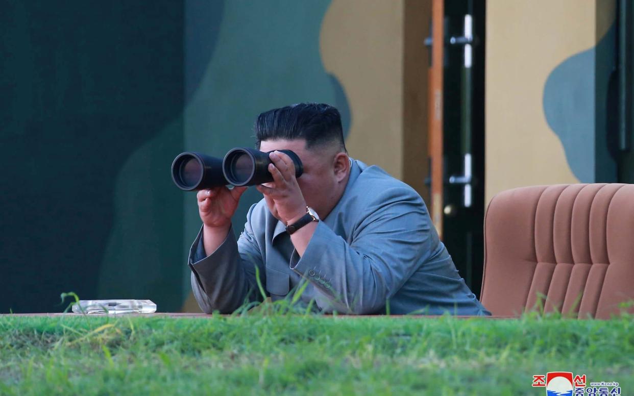 North Korean leader Kim Jong Un watches the test-fire of two short-range ballistic missiles - REUTERS