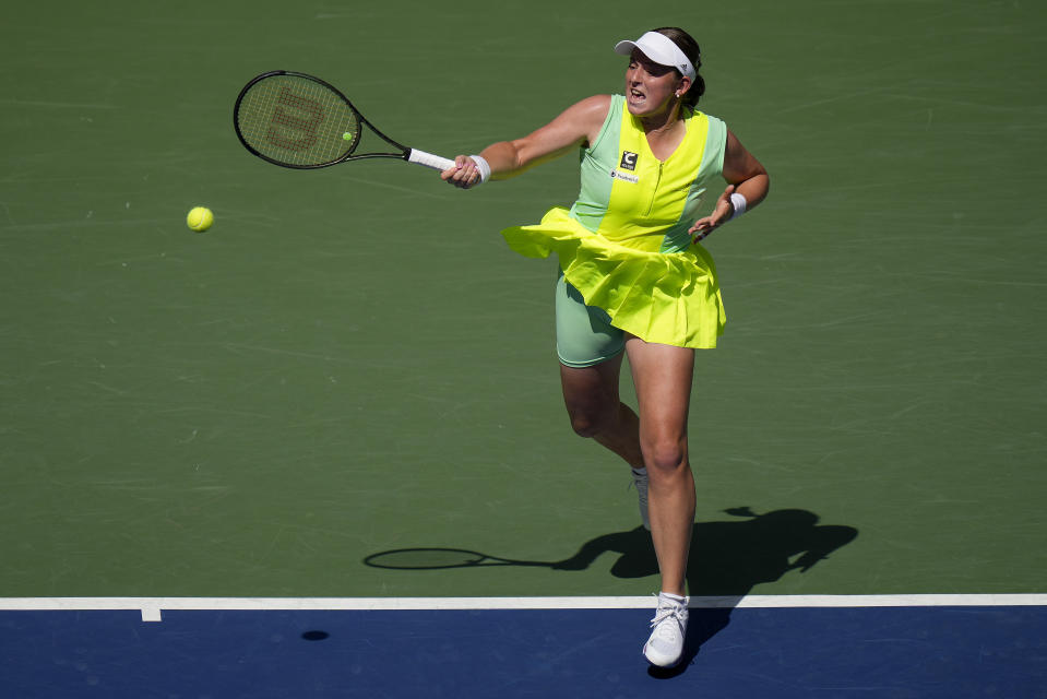 Jelena Ostapenko, of Latvia, returns a shot to Coco Gauff, of the United States, during the quarterfinals of the U.S. Open tennis championships, Tuesday, Sept. 5, 2023, in New York. (AP Photo/Seth Wenig)