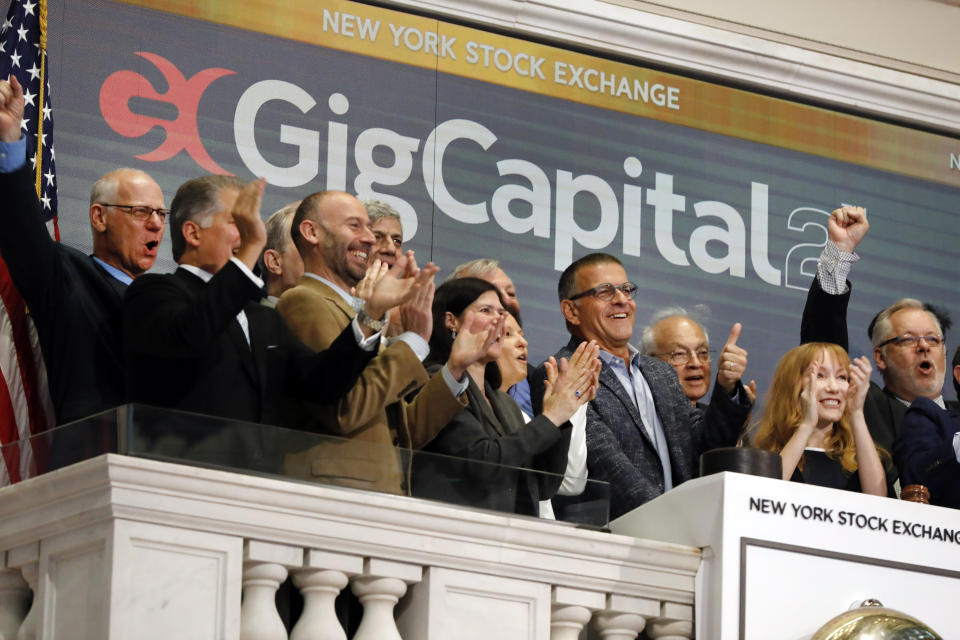 GigCapital2 CEO Dr. Avi Katz, fourth from right, gives a thumbs-up as he rings the New York Stock Exchange opening bell, Tuesday, June 11, 2019, to celebrate the recent IPO of the company. (AP Photo/Richard Drew)