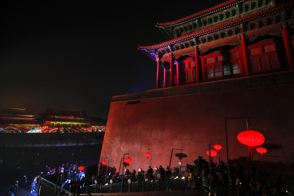 Visitors tour the Forbidden City decorated with red lanterns and illuminated with lights during the Lantern Festival in Beijing, Tuesday, Feb. 19, 2019. (Photo: Andy Wong/AP)