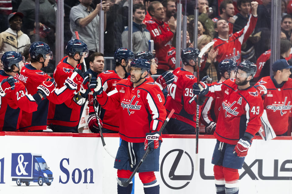 Washington Capitals left wing Alex Ovechkin (8), followed by right wing Tom Wilson (43), is congratulated for his goal against the Philadelphia Flyers during the second period of an NHL hockey game Friday, March 1, 2024, in Washington. (AP Photo/Manuel Balce Ceneta)