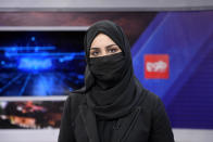 Khatereh Ahmadi a TV anchor wears a face covering as she reads the news on TOLO NEWS, in Kabul, Afghanistan, Sunday, May 22, 2022. Afghanistan's Taliban rulers have begun enforcing an order requiring all female TV news anchors in the country to cover their faces while on-air. The move Sunday is part of a hard-line shift drawing condemnation from rights activists. (AP Photo/Ebrahim Noroozi)