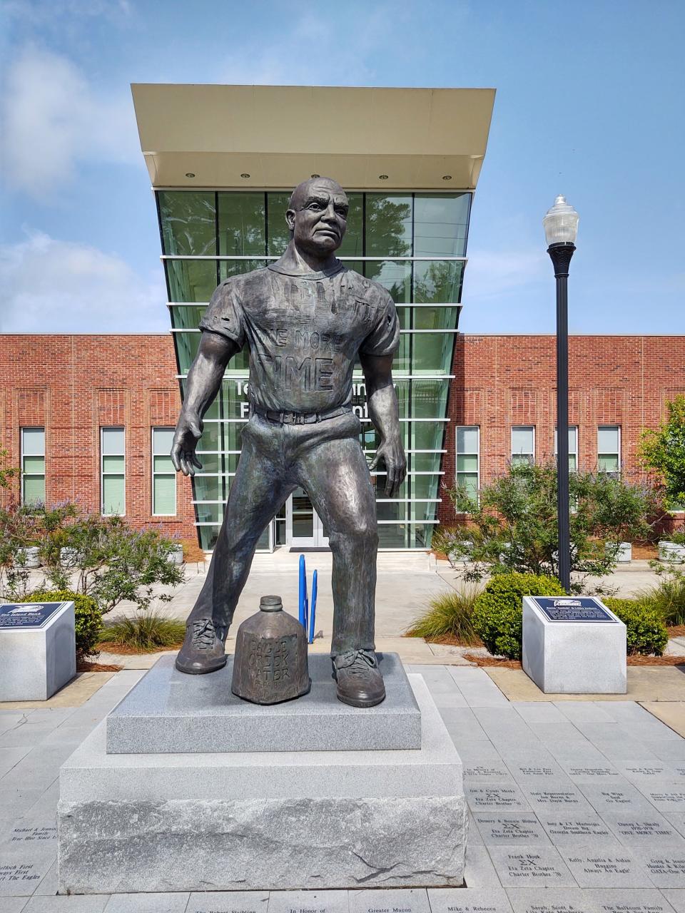 A statue of Georgia Southern Universityl coaching legend Erk Russell stands in the foreground of the Football Operations Center on the Statesboro campus.