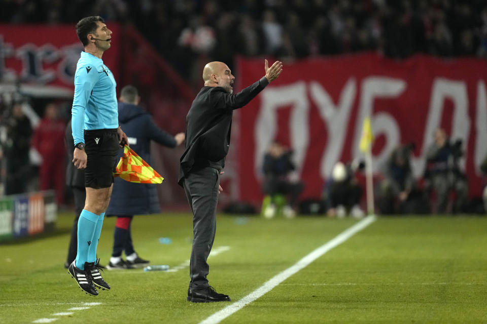 Manchester City's head coach Pep Guardiola gives instructions from the side line during the Group G Champions League soccer match between Red Star and Manchester City, at the Rajko Mitic Stadium in Belgrade, Serbia, Wednesday, Dec. 13, 2023. (AP Photo/Darko Vojinovic)