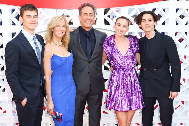 <p>Joe Scarnici/Getty</p> Jessica and Jerry Seinfeld pose with their kids Shepherd, Sascha, and Julian.