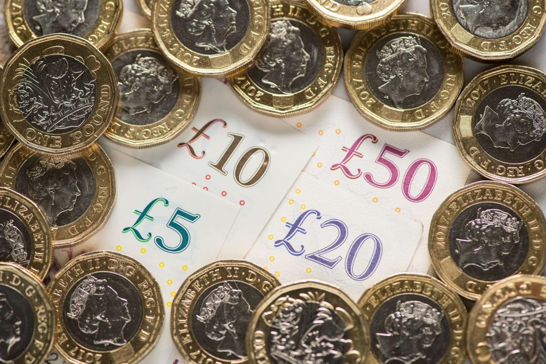 File photo dated 26/01/2018 of a UK five pound, ten pound, twenty pound and fifty pound notes with one pound coins. Councils in England are more than £300 million short of the funding they need to help all of the young people coming to them who are facing homelessness, according to new analysis. Issue date: Monday April 15, 2024.