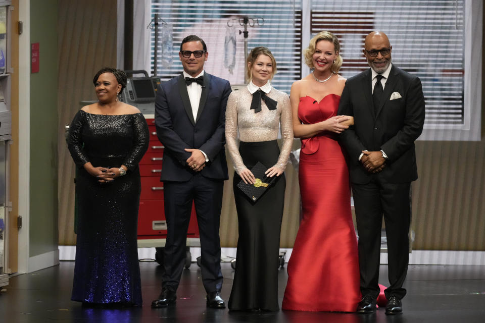 Chandra Wilson, from left, Justin Chambers, Ellen Pompeo, Katherine Heigl, and James Pickens Jr., present the award for outstanding supporting actor in a limited anthology series or movie during the 75th Primetime Emmy Awards on Monday, Jan. 15, 2024, at the Peacock Theater in Los Angeles. (AP Photo/Chris Pizzello)