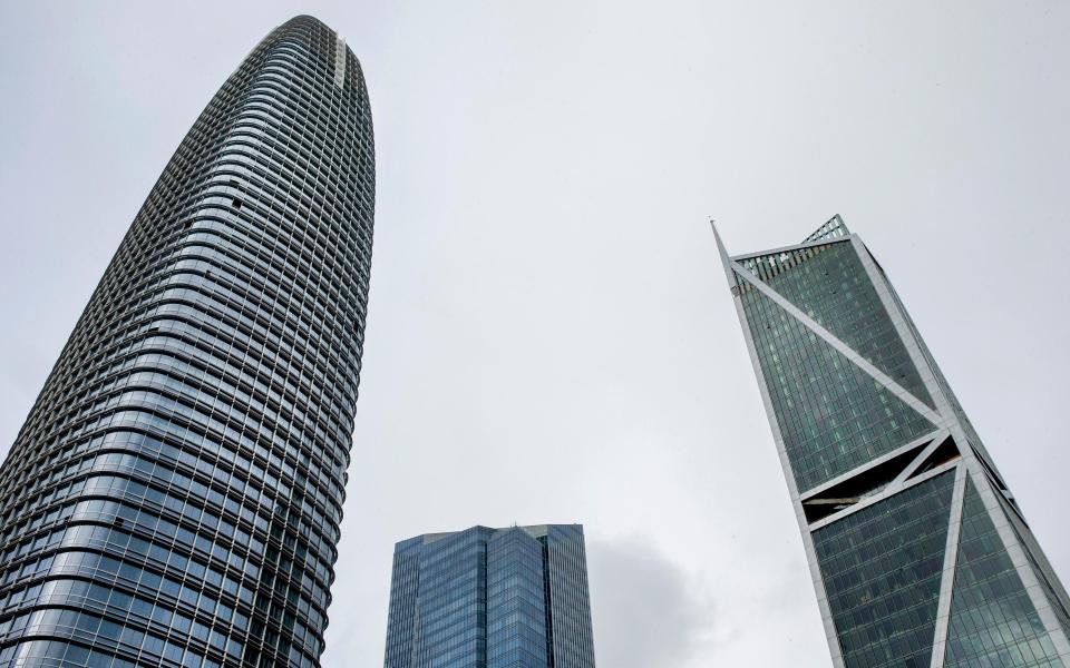 The Millenium Tower in San Francisco (pictured right) is known as the leaning tower, sinking into its sandy foundations - Getty