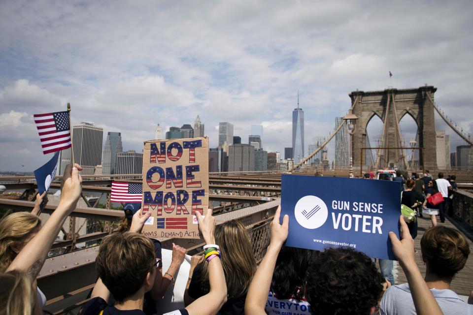 Anti-gun demonstrators march across the Brooklyn Bridge in New York in June 2014.