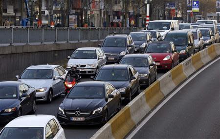 Cars are seen stuck in a traffic jam on a road heading towards central Brussels during the morning rush hour March 26, 2014. REUTERS/Yves Herman