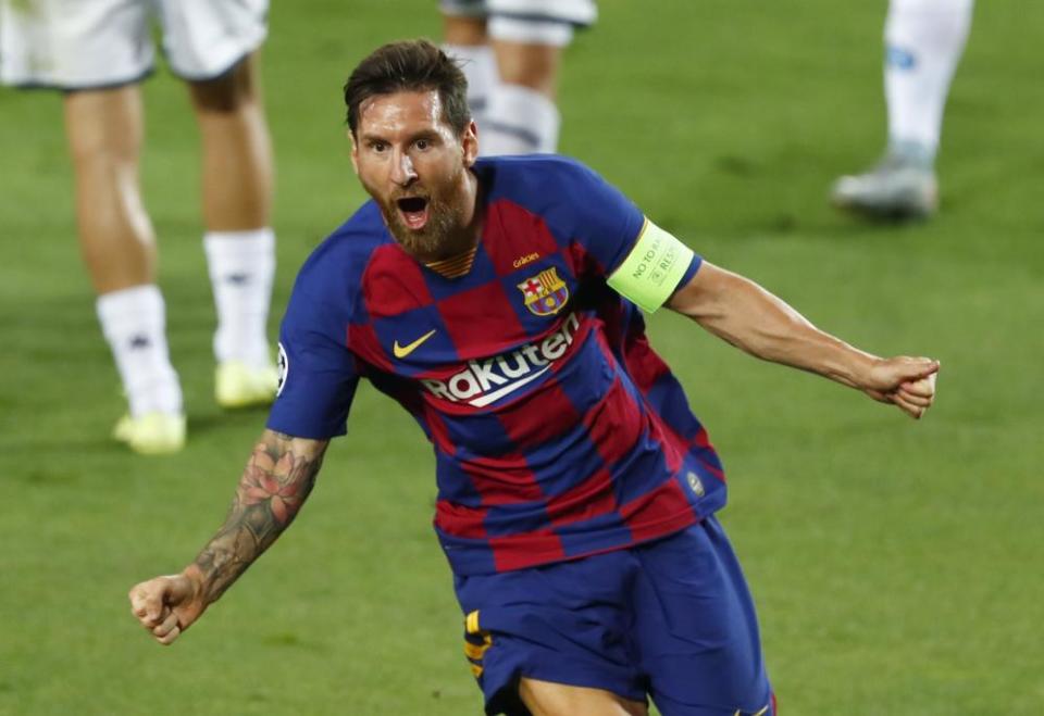 Lionel Messi celebrates after his spectacular solo goal against Napoli.