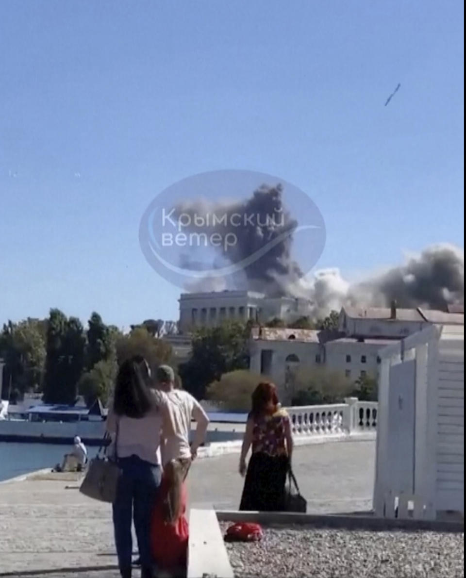 This UGC image shows the moment a missile hits the headquarters of the Russian Black Fleet, in Sevastopol, Friday, Sept. 22, 2023. (Crimean Telegram channel via AP)