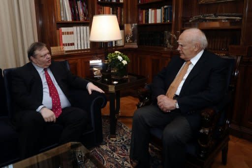 Greek Socialist Party leader Evangelos Venizelos (L) meets with Greek President Carolos Papoulias (R) in his office in Athens. Greece's president will meet political party chiefs on Sunday in a final attempt to get them to agree to a coalition after inconclusive elections that have raised fears of a Greek eurozone exit