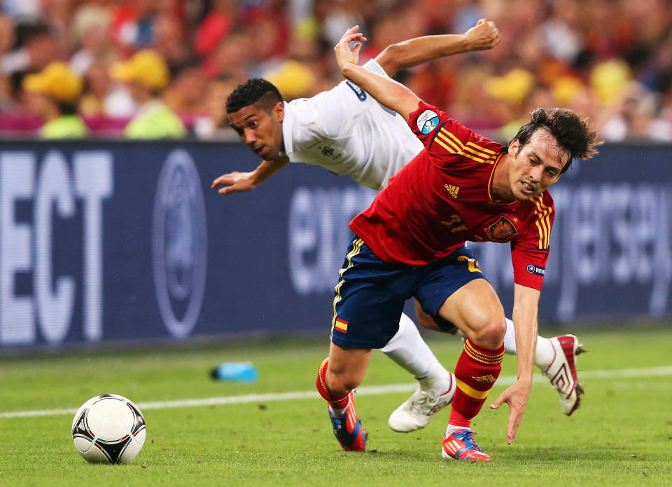 DONETSK, UKRAINE - JUNE 23: Gael Clichy of France and David Silva of Spain challenge for the ball during the UEFA EURO 2012 quarter final match between Spain and France at Donbass Arena on June 23, 2012 in Donetsk, Ukraine. (Photo by Alex Livesey/Getty Images)