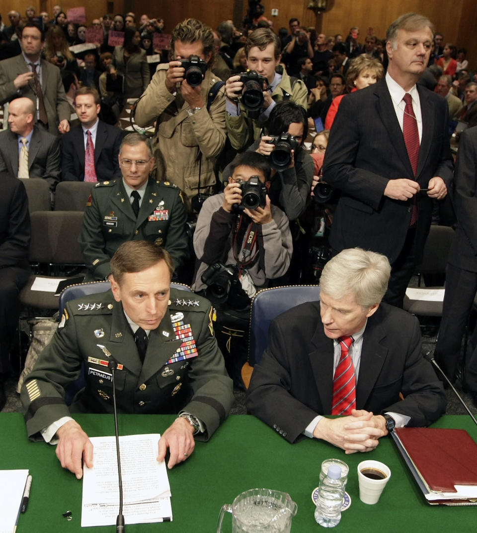 Gen. David Petraeus, left, and Amb. Ryan Crocker prepare to testify on Capitol Hill in Washington, Tuesday, April 8, 2008, before the Senate Armed Services Committee hearing on the status of the war in Iraq. (AP Photo/Pablo Martinez Monsivais)