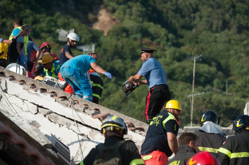 <p>Rescuers dig through the rubble during a search for two missing children on Aug. 22, 2017 in Casamicciola Terme, Italy. (Photo: Ivan Romano/Getty Images) </p>