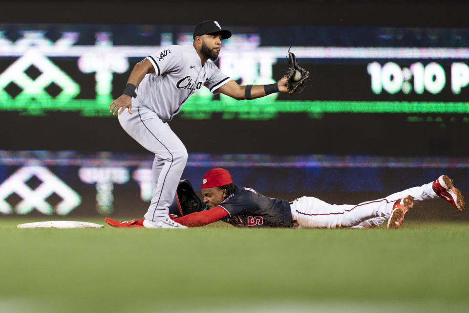 Washington Nationals' CJ Abrams, bottom, steals second in front of Chicago White Sox second baseman Elvis Andrus, top, during the third inning of a baseball game, Monday, Sept. 18, 2023, in Washington. (AP Photo/Stephanie Scarbrough)