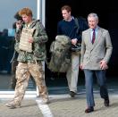 <p>Prince Charles smiles while pictured with his sons, Prince William and Prince Harry. Prince Harry is seen returning from his RAF tour in Afghanistan. </p>